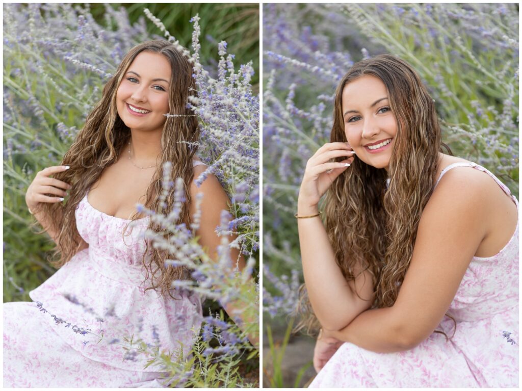 A young woman with long, wavy hair sits smiling amidst lush purple flowers and greenery. She wears a pastel floral dress, exuding a serene, joyful vibe.