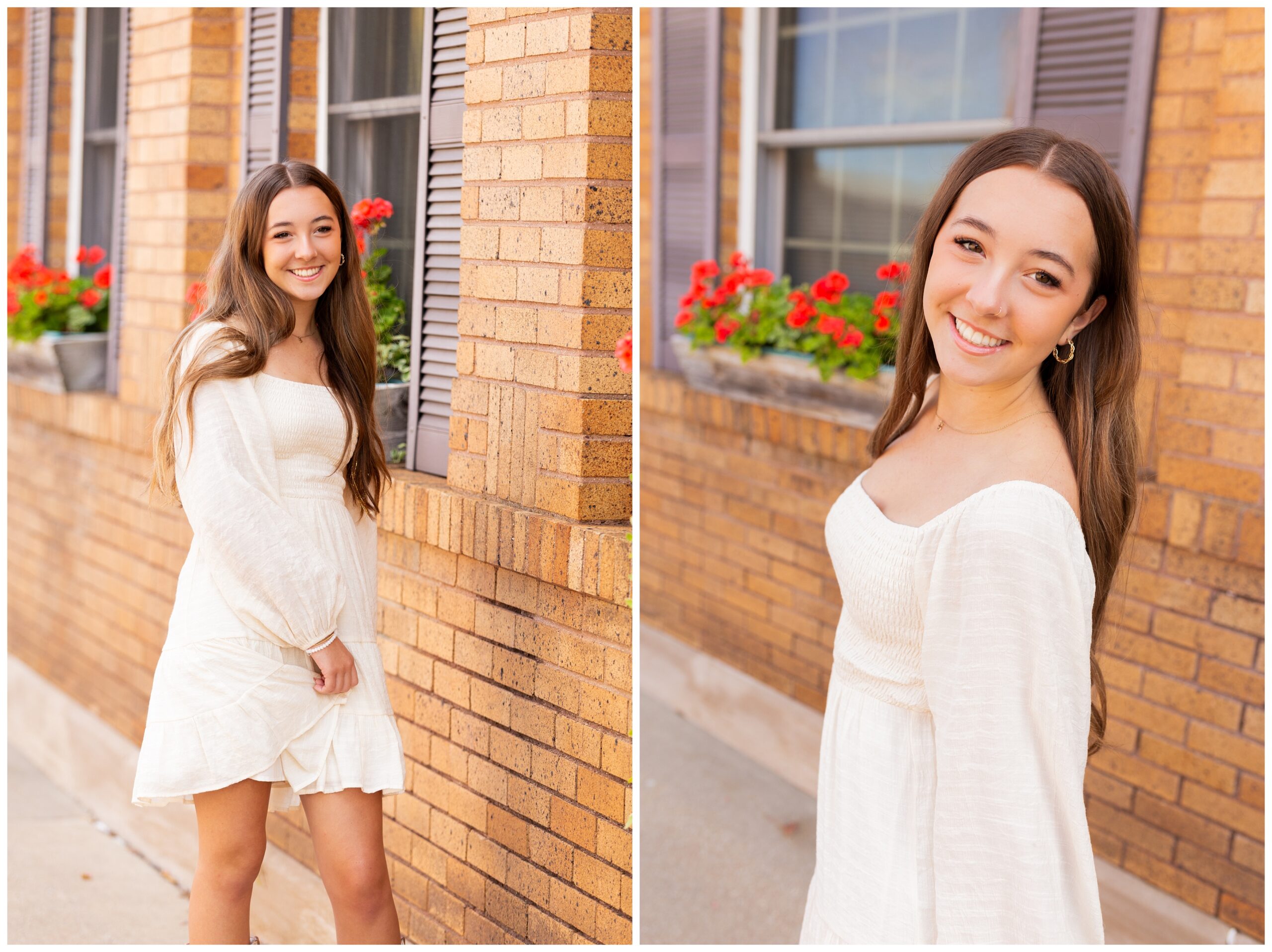 A young woman in a white dress smiles warmly near a brick building with blooming red flowers in window boxes. The atmosphere is bright and cheerful.